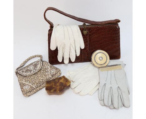 A leather handbag, an evening purse, a compact, gloves etc 