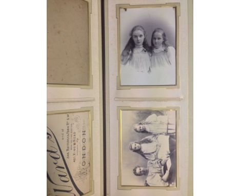 A Victorian leather bound photograph album containing a study of Zulu Girls, family portraits, and a portrait of Colonel Sir 
