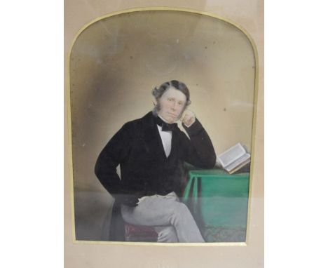 MAYALL (John Jabez Edwin), A Victorian photograph of a Gentleman holding a book seated at a table, original hand colouring, n