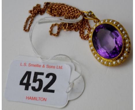 FINE EDWARDIAN 15 CARAT GOLD AMETHYST WITH SEED PEARL SURROUND PENDANT WITH FINE GOLD CHAIN