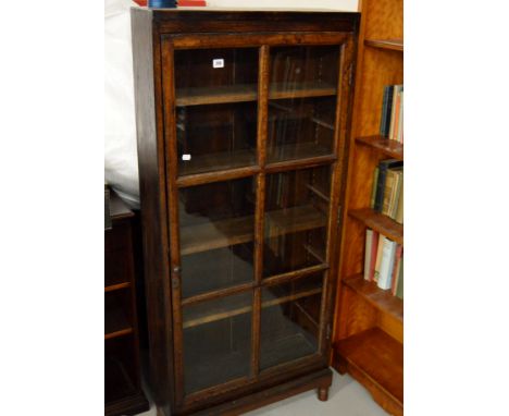 27" STAINED OAK SINGLE DOOR BOOKCASE WITH SECTIONAL GLASS PANEL DOOR