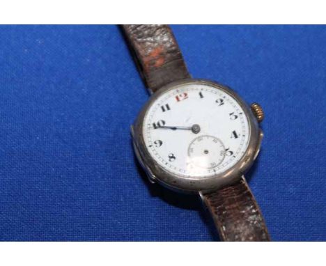 EARLY 20TH CENTURY STERLING SILVER TRENCH STYLE WATCH
unsigned manual wind movement, the white dial with Roman numerals and r