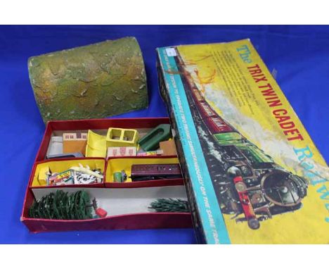 VINTAGE TRIX TWIN CADET RAILWAY
original box filled with accessories, carriages etc; together with a model railway tunnel (2)