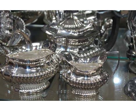 LOT OF SILVER PLATED WARE
including an attractive gadrooned three piece tea service, two candlesticks, silver topped sugar ca