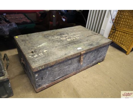 An ex-military metal and wooden bound travelling trunk
