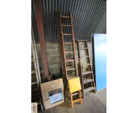 A triple extending wooden ladder