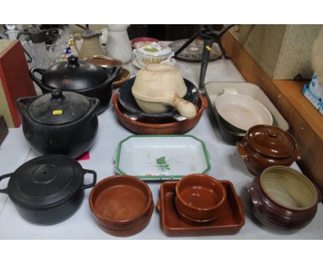 Two Le Creuset cooking dishes, various pottery and stoneware dishes, an enamel decorated dish etc.