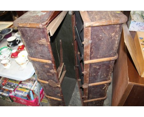 A large canvas and wooden bound travelling trunk fitted with drawers and hangers