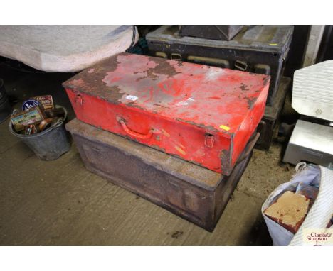A red metal box and vintage ammunition box
