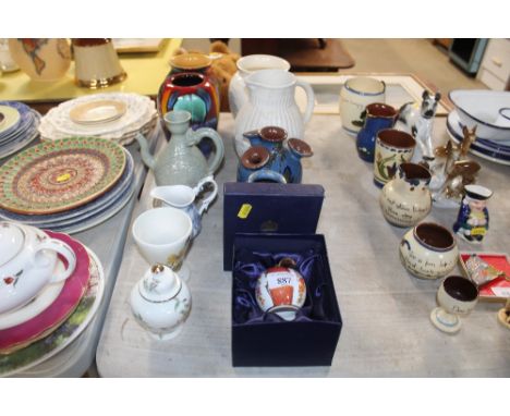 A Royal Worcester candle snuffer in the form of a peach; two Poole pottery vases; Wedgwood white glazed vase; a pottery ewer;