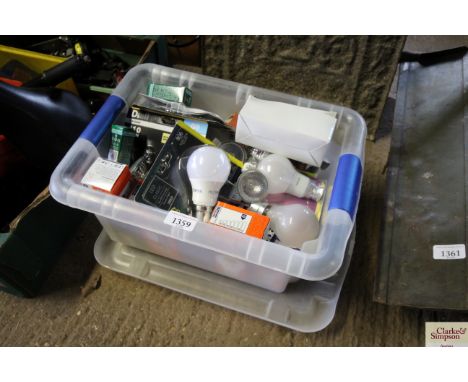 A plastic box and contents of various light bulbs
