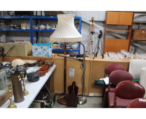 A reproduction mahogany magazine rack, a standard lamp with shade, an adjustable reading light etc.