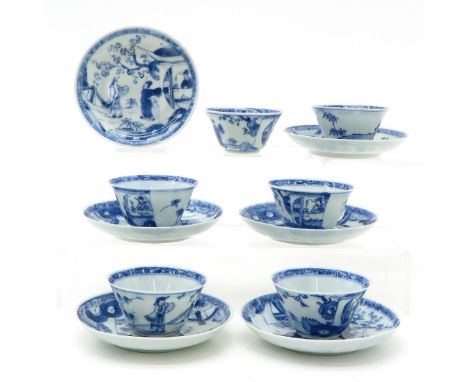 Blue and white decor depicting gathering of Chinese men in garden, saucers are 11 cm. in diameter, some with chip and hairlin
