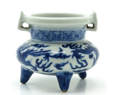Blue and white dragon decor, marked with double ring and 6 characters, 7 cm. tall.