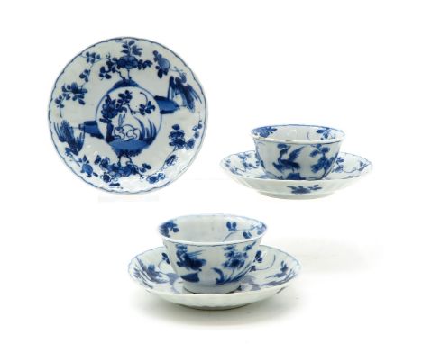 Including 2 cups and 3 saucers, blue and white decor with rabbits, marked on bottom, with Lozenge, saucers are 11 cm. in diam