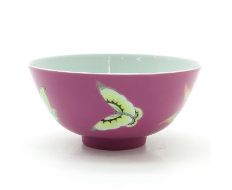 Pink background with butterfly decor, marked on bottom with double ring and 6 characters, 15 cm. in diameter.