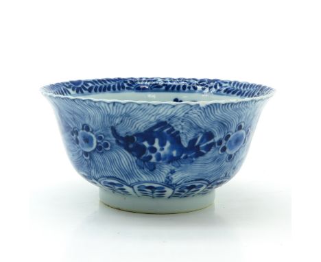 Blue and white decor of flowers and fish, marked with double ring and 4 characters, 15 cm. in diameter, chip.