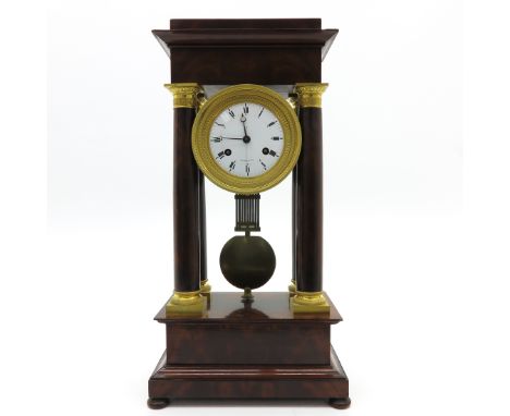 In mahogany case with gold gilt elements, also with second hand.  A similar example of this clock may be found in the book ti