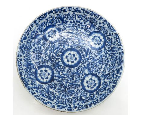 Blue and white floral decor, marked with double ring on bottom, 36 cm. in diameter, chip and hairline.