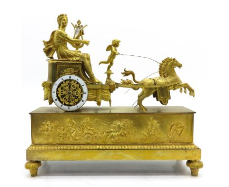 Depicting gold gilt horse drawn carriage with Putti and, exceptional quality and size. A similar example of this clock may be