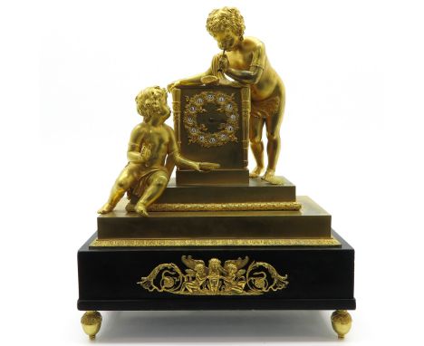 Empire period, depicting 2 gold gilt children leaning on movement with enamel cartouches, minute hand and small piece of marb