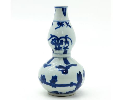 Blue and white decor, marked on bottom with double ring and 6 characters, 20 cm. tall.
