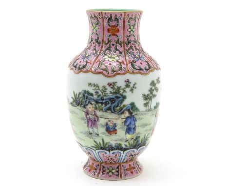 Polychrome decor depicting children playing in garden, marked on bottom with seal mark, 18 cm. tall.