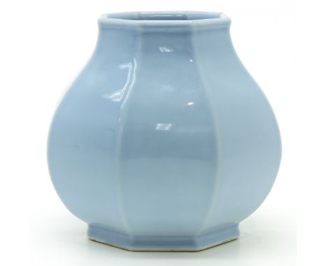 Light blue glaze, 15 cm. tall, marked on bottom with seal mark, 15 cm. tall.