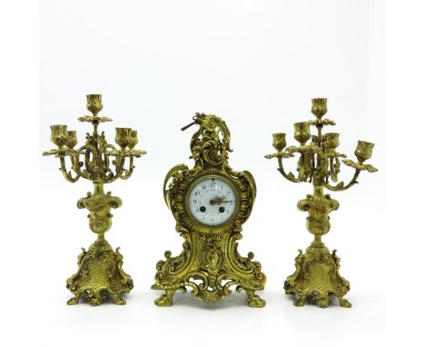 Including candlesticks and clock, 40 cm. tall.