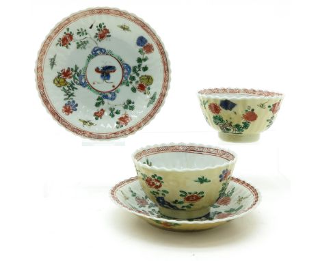 Polychrome decor with Cafe au Lait background, saucers are 13 cm. in diameter, some with chip and hairline.