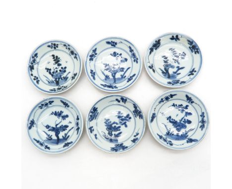 Blue and white floral decor with cappuccino, marked on bottom with double ring and symbol, 11 cm. in diameter, chip and hairl