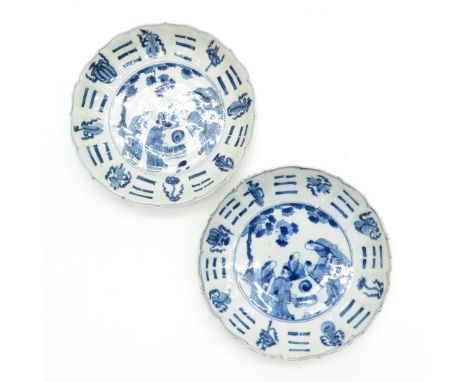 Blue and white decor depicting gathering of men in garden, marked with double ring and 6 characters, chip and hairline.