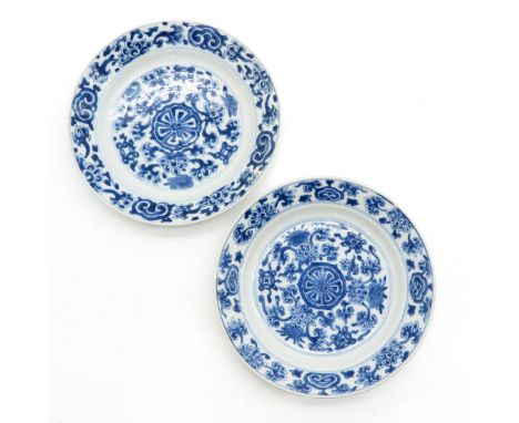 BLue and white floral decor, marked with double ring and 6 characters, 17 cm. in diameter, chip and one with hairline.