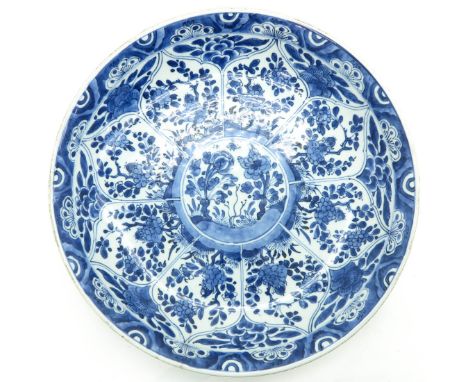Kangxi, blue and white floral decor, marked on bottom with double ring, 36 cm. in diameter, chip and hairline.