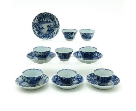 Including 6 saucers and 8 cups, blue and white decor, saucers are 10 cm. in diameter, some with chip and hairline.