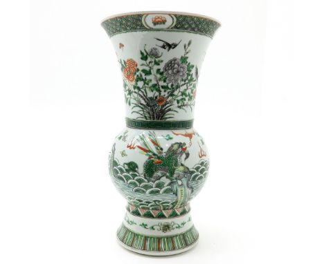 Famille Verte decor depicting flowers and dragon, marked with double ring and 6 characters, 43 cm. tall.