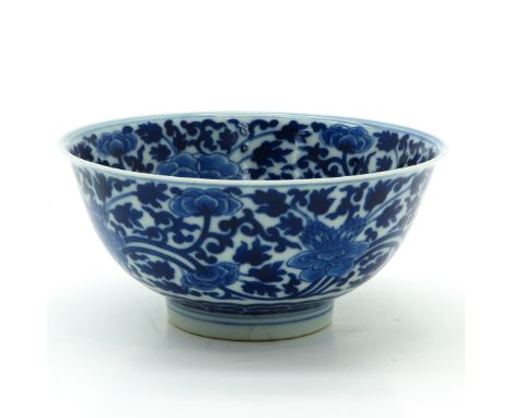 Blue floral decor, marked with double ring and 6 characters, 13 cm. in diameter, restored chip.