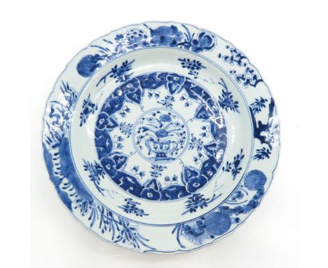 Blue floral decor, marked on bottom with double ring and leaf, 36 cm. in diameter, chip and hairline.