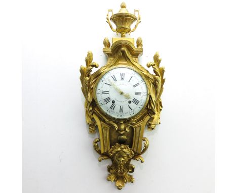 Gold gilt. A similar example to this clock may be found in the book titled La Pendule Francaise on page 100, 39 x 92 x 14 cm.