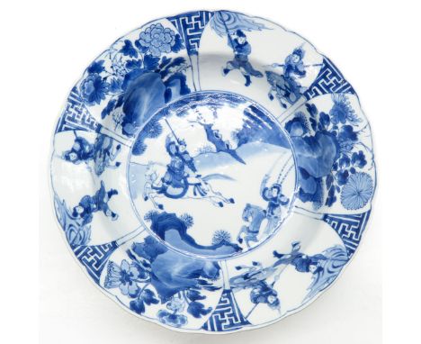 Blue and white decor depicting warriors, marked on bottom with double ring and6 characters, 26 cm. in diameter, chip and hair
