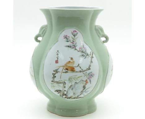 Light green background with polychrome decor and signed Chinese text, 37 cm. tall.