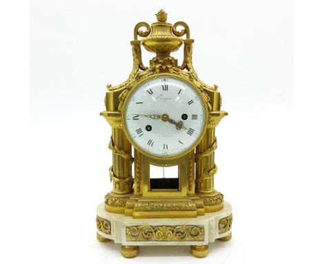 Gold gilt decor on white marble base, also signed on back of clock, 27 x 45 x 17 cm.