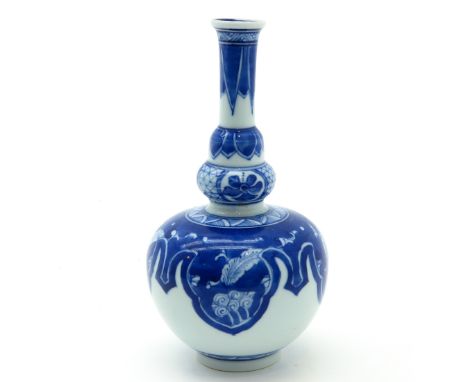 Blue and white decor, marked on bottom with double ring, 17 cm. tall.