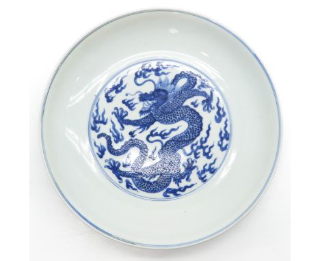 Blue and white dragon decor, marked with double ring and 6 characters on the bottom, 27 cm. in diameter. 