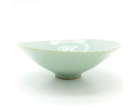 Light green glaze, 22 cm. in diameter, chip.