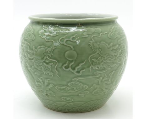 Depicting cloud and dragon decor, marked on bottom with double ring, 21 cm. tall.