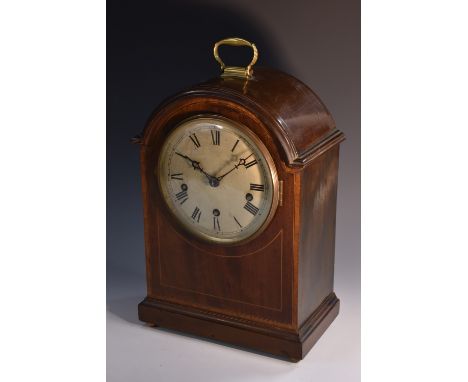 An early 20th century mahogany arched rectangular mantel clock,  satinwood strung and crossbanded, 16cm diam with Roman numer