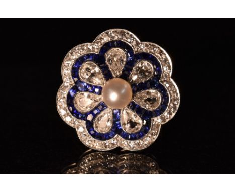 A diamond sapphire and pearl cluster ring, central pearl within a seven petal surround pave encrusted with seven pear drop, t