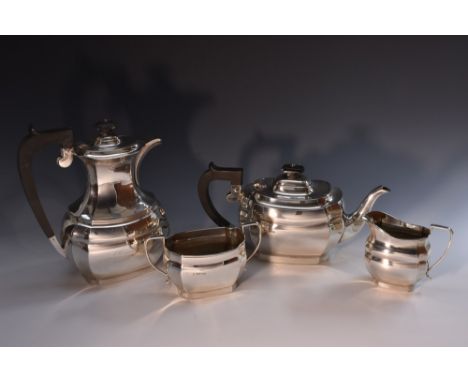 An Elizabeth II silver four piece boar shaped tea service, comprising teapot, water pot, milk jug and sugar basin, hinged dom