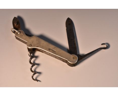 A late Victorian silver multi-tool penknife, with an arrangement of blades, button hook and corkscrew, 10.5cm wide (folded), 